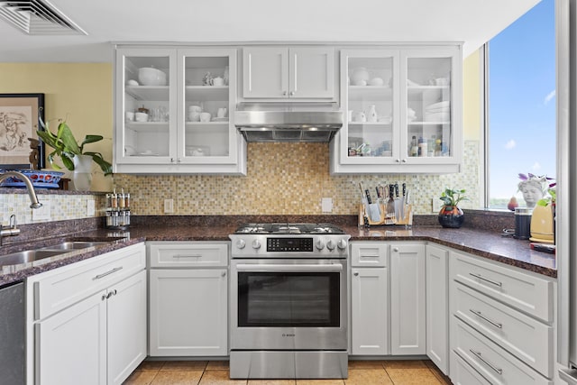 1 Miranova Pl Unit 1505, Columbus, OH 43215 - kitchen featuring stainless steel gas range oven, under cabinet range hood, a sink, backsplash, and light tile patterned floors