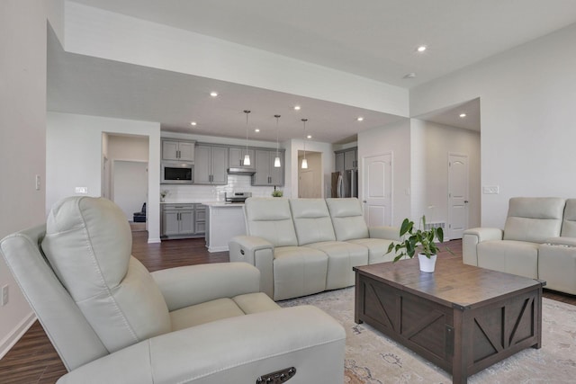 living room featuring light wood-style floors and recessed lighting