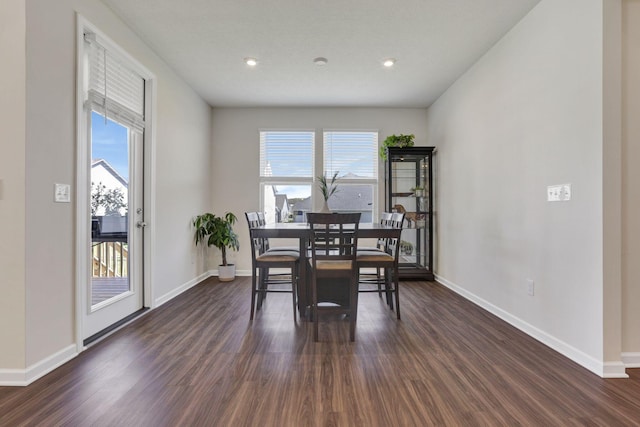 dining space with recessed lighting, baseboards, dark wood finished floors, and a wealth of natural light