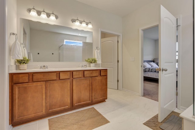 bathroom with double vanity, a shower stall, a sink, and marble finish floor