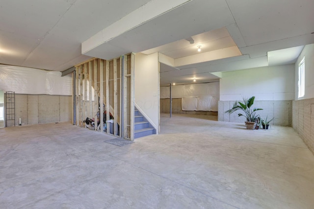 basement featuring stairs