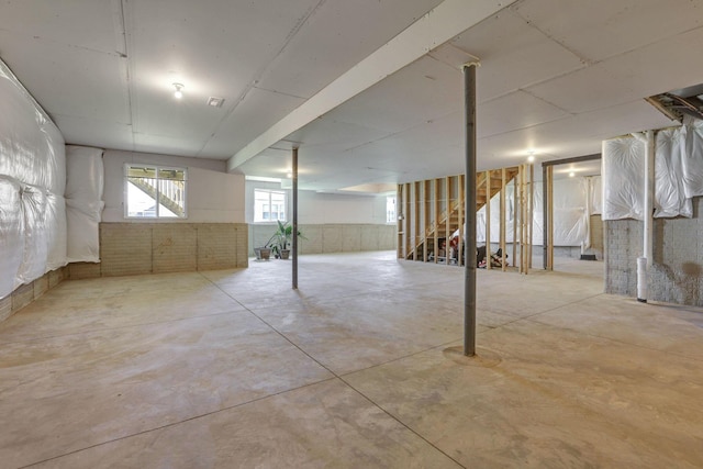 basement featuring stairs