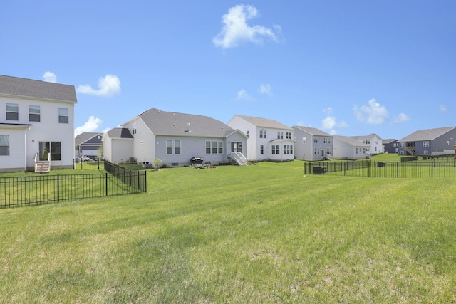 view of yard featuring a residential view and a fenced backyard