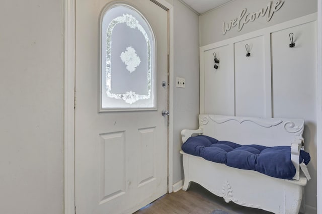 mudroom featuring baseboards and wood finished floors