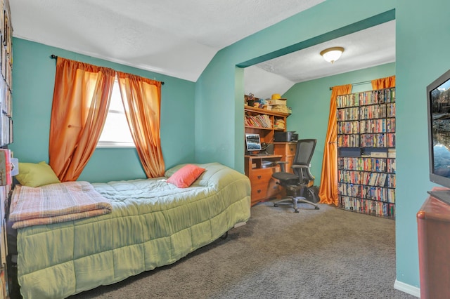 bedroom with carpet and lofted ceiling
