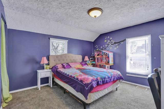 carpeted bedroom with baseboards, visible vents, multiple windows, and vaulted ceiling