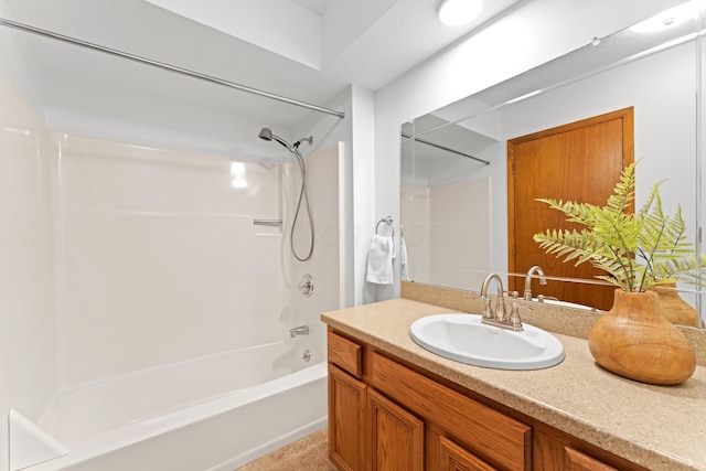full bath featuring vanity and shower / bathtub combination