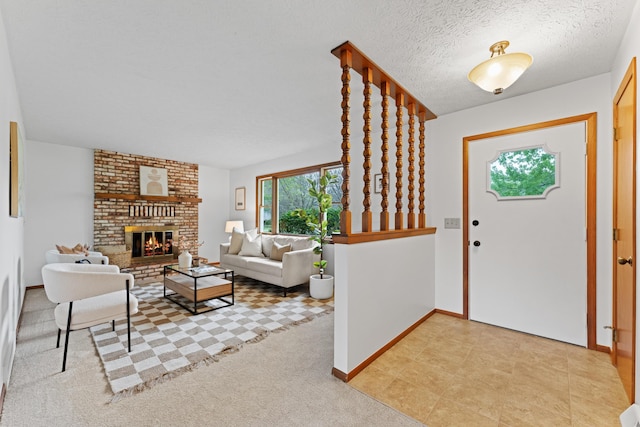 entrance foyer with baseboards, a brick fireplace, and light colored carpet