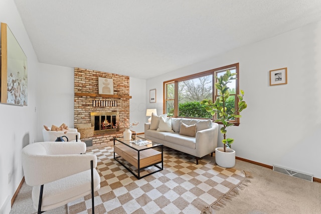 living area with baseboards, a fireplace, carpet floors, and visible vents