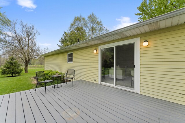 wooden terrace with a yard