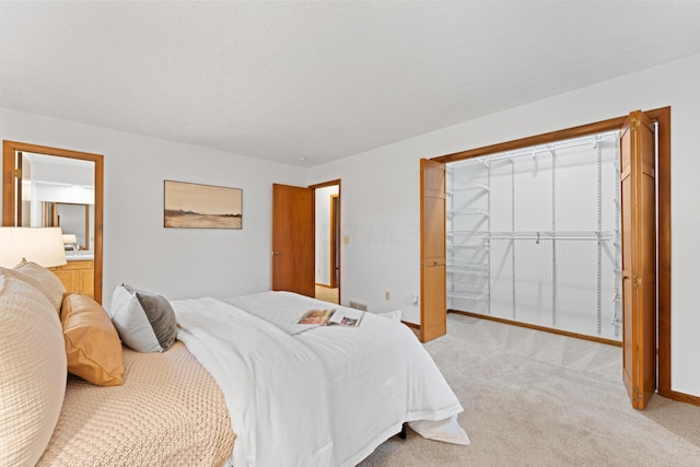 bedroom featuring baseboards and light carpet