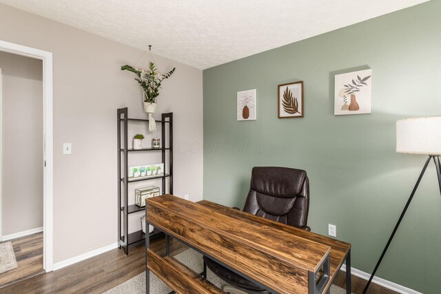 office with baseboards, a textured ceiling, and dark wood-style flooring