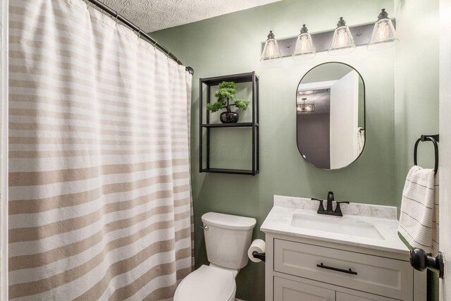 full bath featuring toilet and vanity