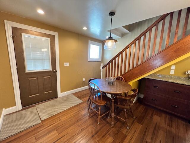 dining space featuring stairs, recessed lighting, baseboards, and dark wood-type flooring