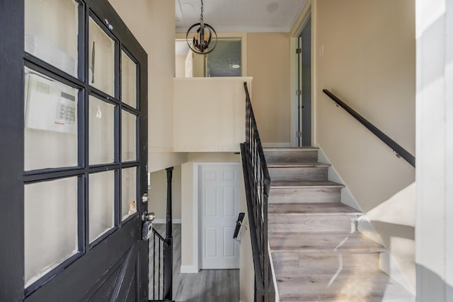 stairs featuring baseboards and wood finished floors