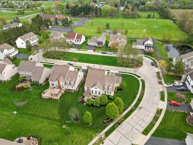 aerial view with a residential view and a water view
