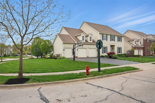 view of front of home featuring a residential view, a front lawn, and aphalt driveway