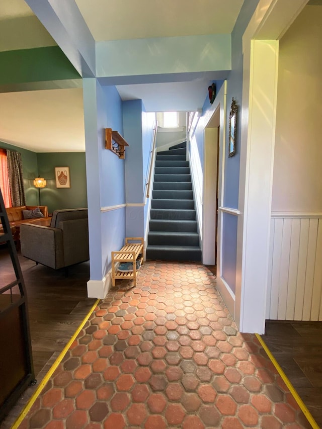 stairway with wood finished floors