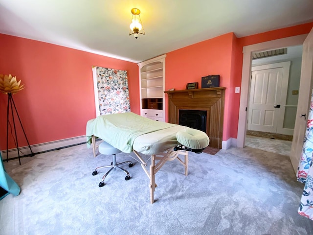 playroom featuring baseboard heating, a fireplace, carpet, baseboards, and visible vents