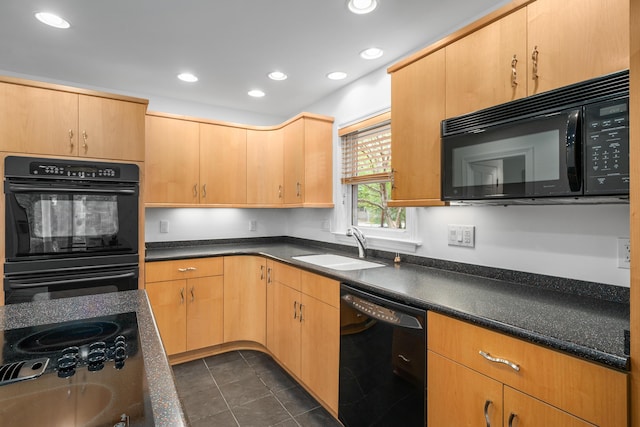 kitchen with recessed lighting, a sink, and black appliances