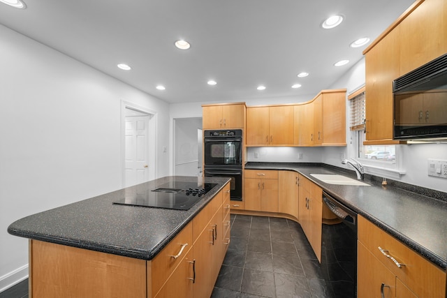 kitchen featuring a kitchen island, recessed lighting, dark tile patterned floors, a sink, and black appliances