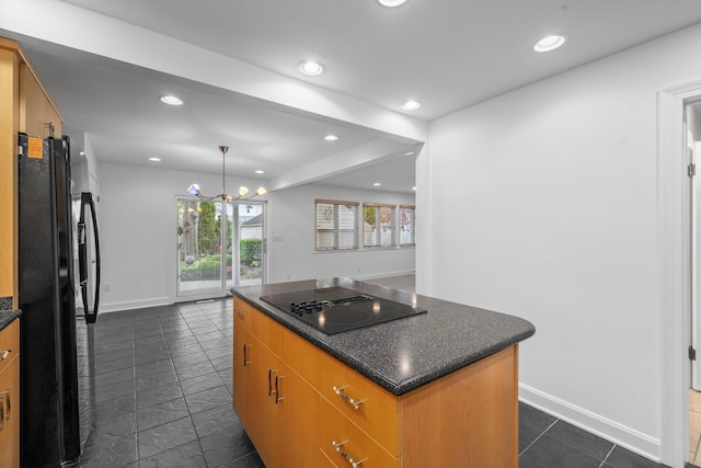kitchen featuring a kitchen island, recessed lighting, baseboards, and black appliances