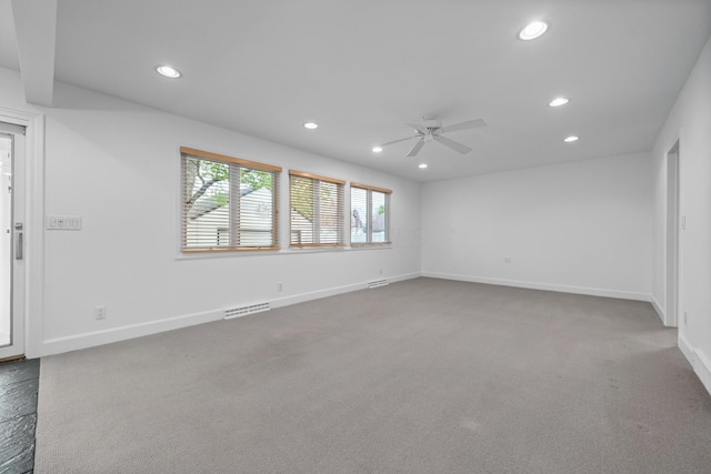 carpeted spare room with recessed lighting, baseboards, ceiling fan, and visible vents