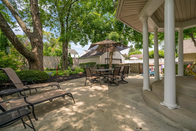 view of patio featuring a fenced backyard and outdoor dining space