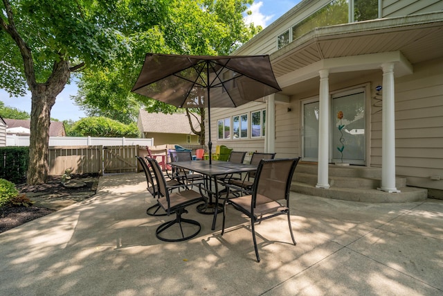 view of patio / terrace featuring fence and outdoor dining area