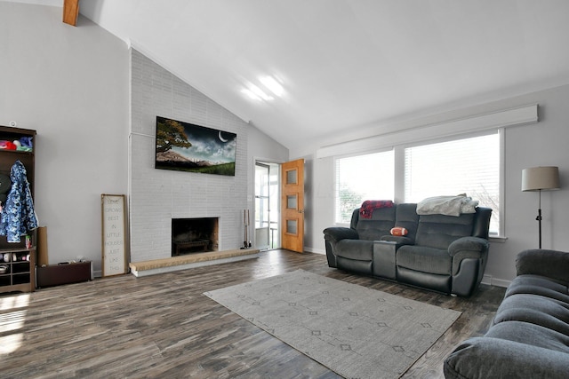 living room featuring high vaulted ceiling, a fireplace, and wood finished floors