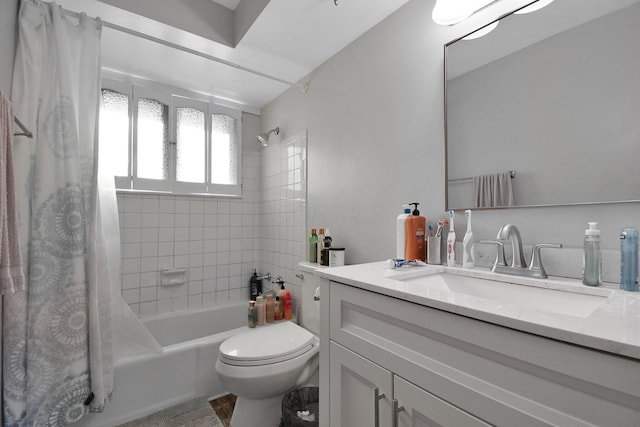 full bath featuring vanity, shower / bath combo, and toilet
