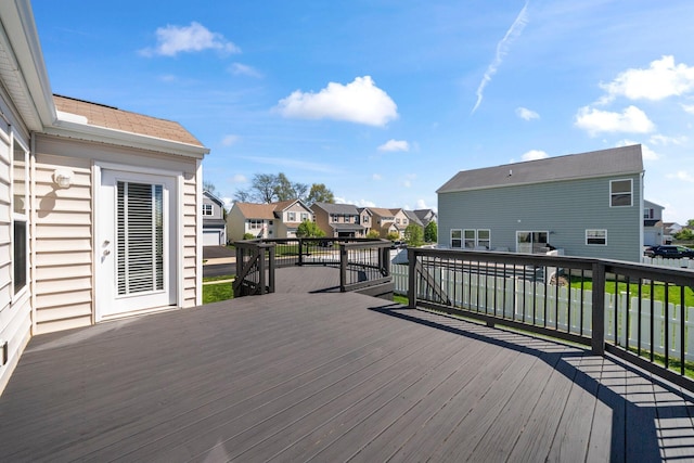 wooden deck with a residential view