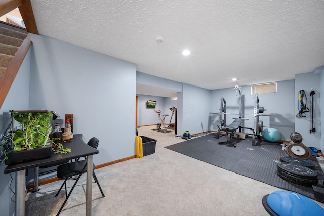 workout room with carpet floors, recessed lighting, a textured ceiling, and baseboards