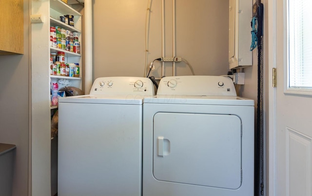 laundry room featuring cabinet space and washer and dryer