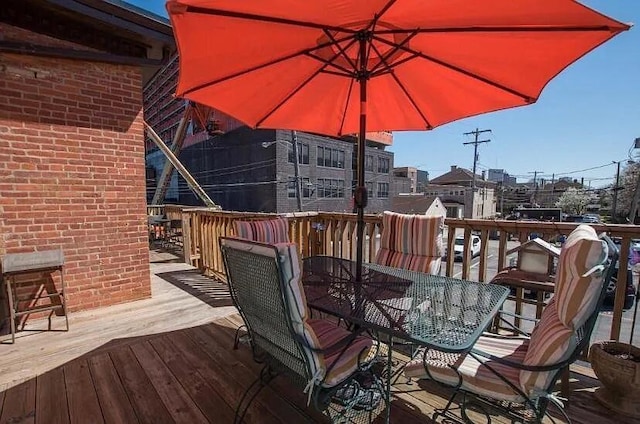 deck featuring outdoor dining area