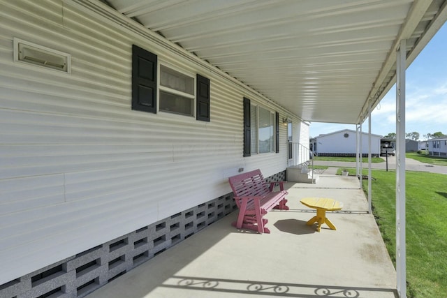 view of patio / terrace with a carport