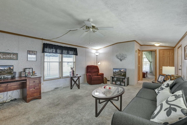 living area with carpet flooring, visible vents, crown molding, and a textured ceiling