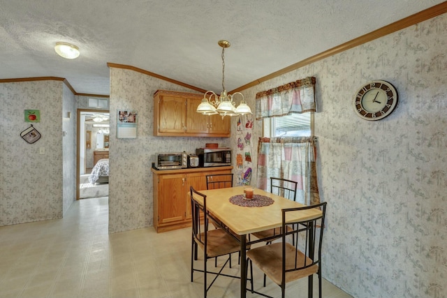 dining room with crown molding, an inviting chandelier, and wallpapered walls
