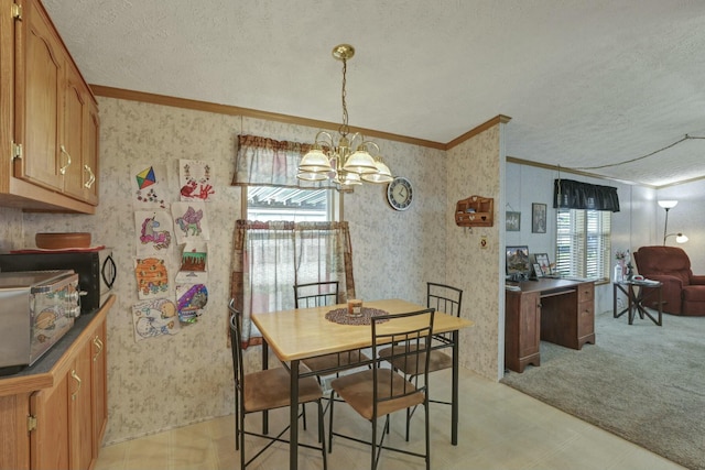 dining room with wallpapered walls, crown molding, and a textured ceiling