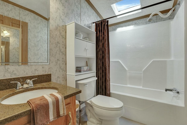 bathroom featuring a skylight, toilet, vanity, shower / bathtub combination with curtain, and wallpapered walls