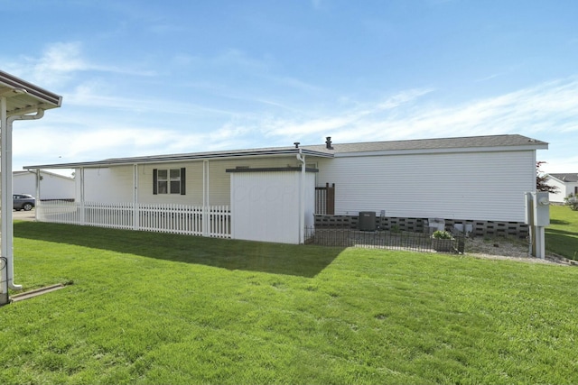 rear view of house with a yard