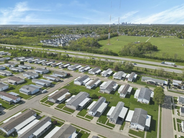 birds eye view of property with a residential view