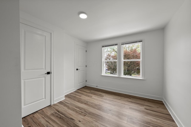 2671 Whitehead Rd, Columbus, OH 43204 - unfurnished bedroom with baseboards and wood finished floors