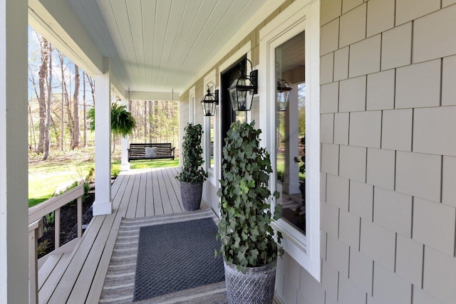 wooden terrace with a porch
