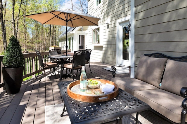 deck with outdoor dining space and an outdoor living space