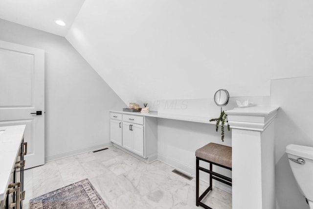 bathroom featuring visible vents, marble finish floor, lofted ceiling, toilet, and baseboards