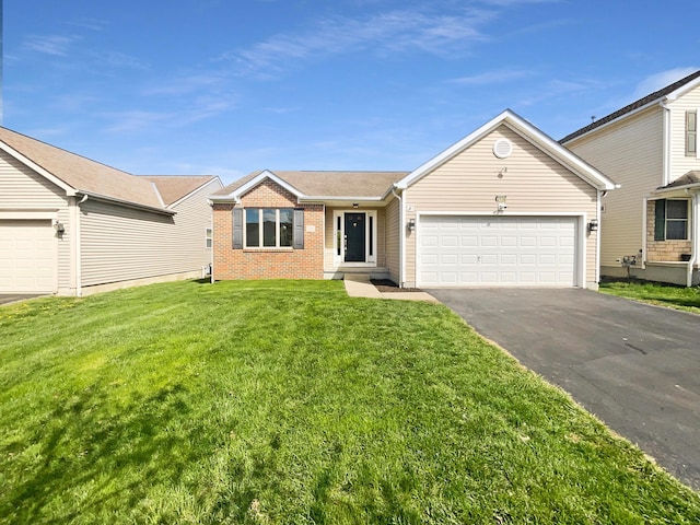 2136 Staghorn Way, Grove City, OH 43123 - single story home with asphalt driveway, brick siding, a garage, and a front lawn