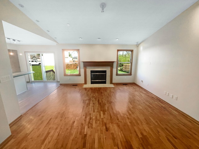 2136 Staghorn Way, Grove City, OH 43123 - unfurnished living room with light wood-style floors, a fireplace, and baseboards