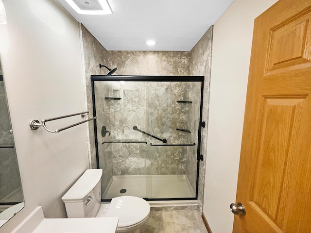 2136 Staghorn Way, Grove City, OH 43123 - bathroom with toilet, a shower stall, and baseboards