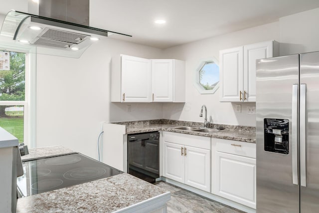 kitchen featuring recessed lighting, a sink, white cabinetry, and black appliances